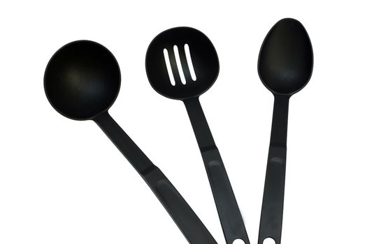 3 different black ladles on a white background