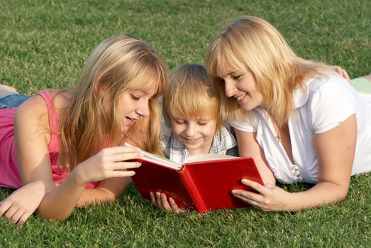 Mother with her children on the meadow