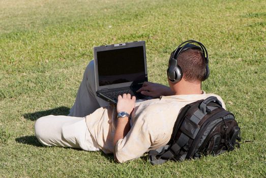 Boy using notebook outdoor