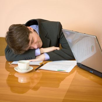 Young businessman has fallen asleep sitting at meeting