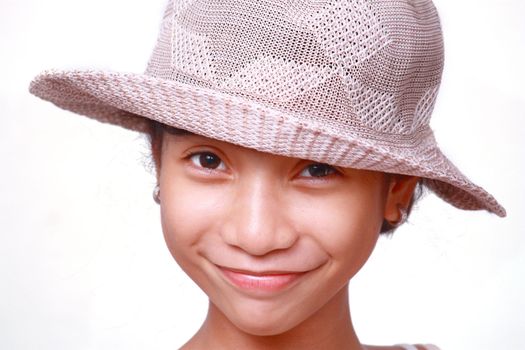 portrait of a smiling happy asian girl wearing a straw hat