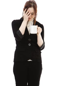 Young business woman with a cup of coffee and a expression of disbelief against white background