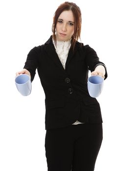 Young business woman with frustrated expression presenting two cups of coffee against white background