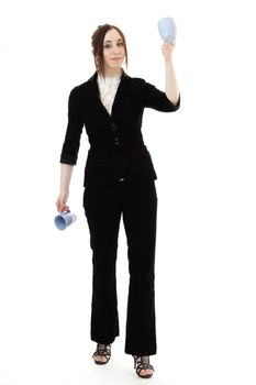 Young business woman juggling cup of coffee against white background