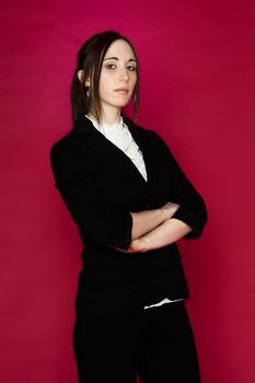 Young business woman against pink background