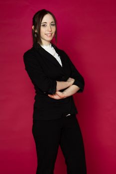 Young business woman against pink background