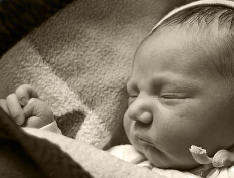 Portrait of newborn sleeping child.