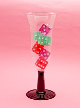  	
glass of champagne with dice