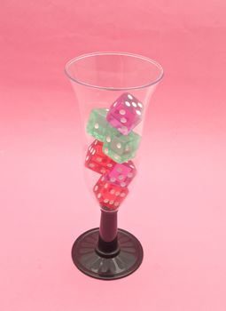 glass of champagne with dice