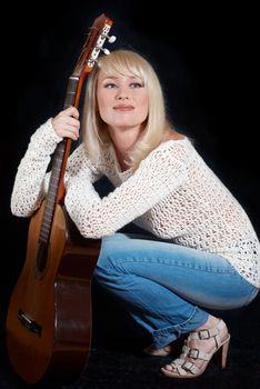 blonde women and guitar