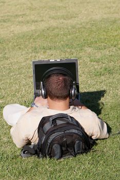 Boy using notebook outdoor