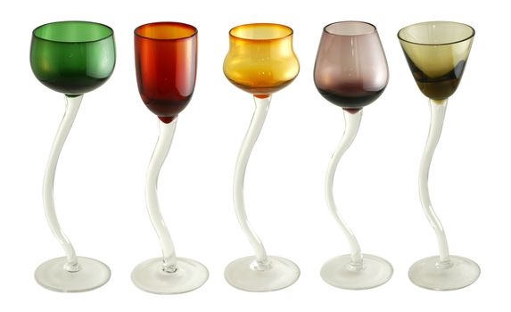 Fun colorful handcrafted coktail glasses with curved handle isolated on white.