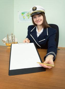 Young woman - captain with the tablet at office