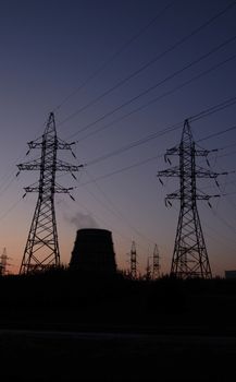 Power station over orange and blue sky