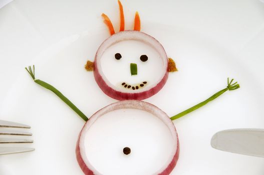 Man made out of vegetable on a dish.