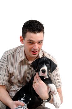 Young man is holding his sweet puppy dog