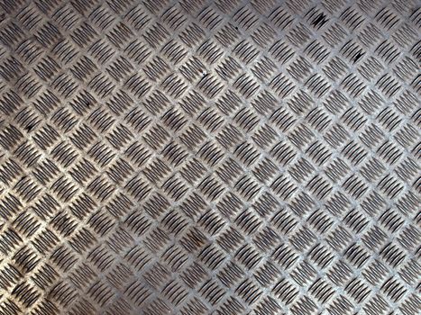 Diamond steel plate useful as a background