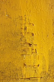 Old wooden surface painted in bright yellow