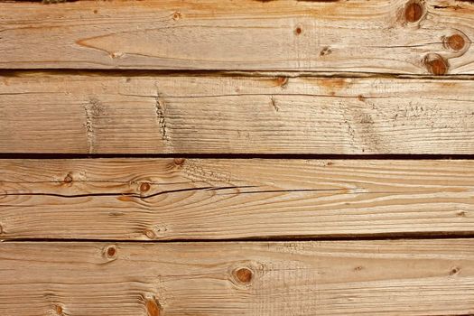 Horizontal parallel wooden old logs. Part of wooden house walls