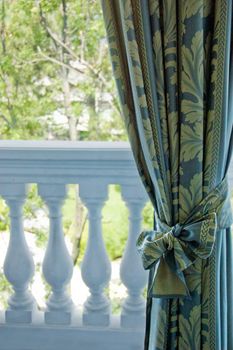 Luxury curtains over window towards balcony