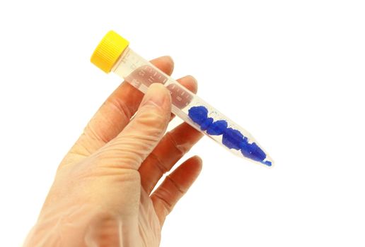 hand with chemicals in tube isolated