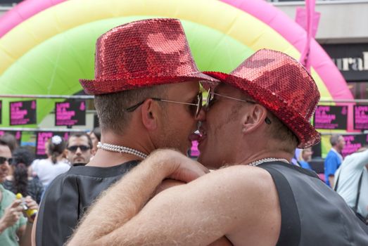 LONDON - JULY 4: Gay Pride participants kissing in the its 37th edition July 4, 2009 in London, England.