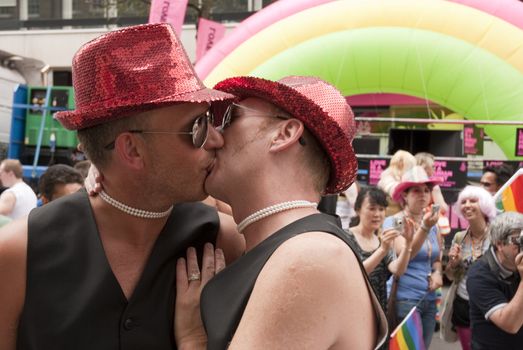 LONDON - JULY 4: Gay Pride participants kissing in the its 37th edition July 4, 2009 in London, England.