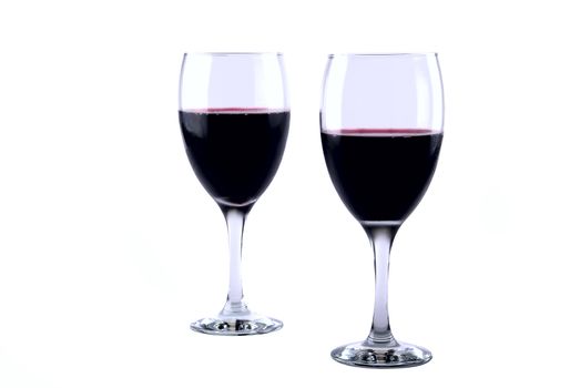 Set of two full wine glasses on white background