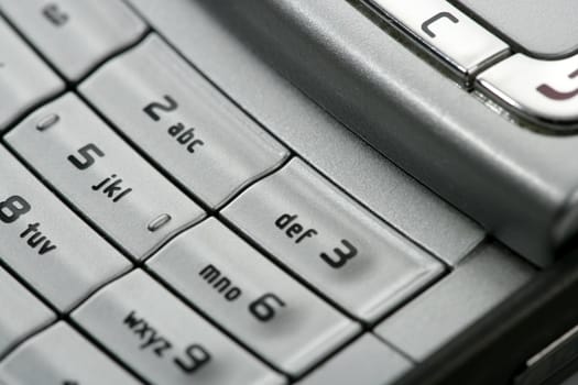 Mobile phone macro keyboard detail, electronics closeup