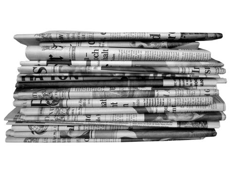 Stack of international newspapers - in black and white