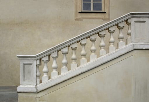 Stone baroque balaustrade as a staircase handrail