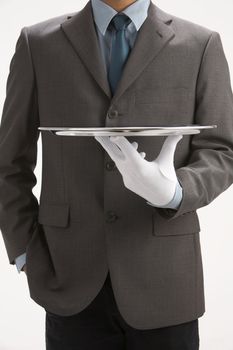 asale person holding a  sliver empty tray