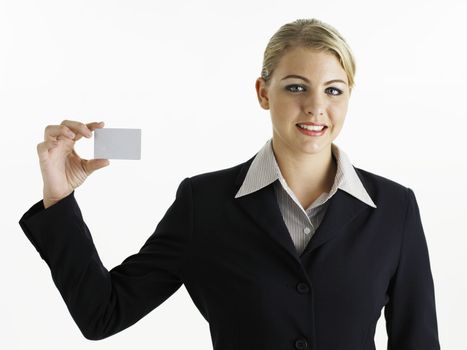young business woman holding card looking at camera