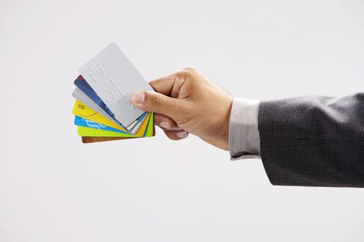 man showing few credit cards with white background
