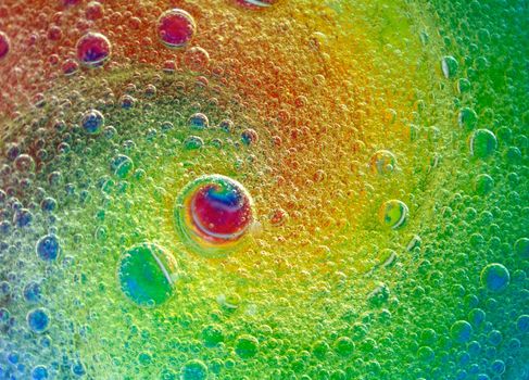 Water and oil drops in a psychedelic spiral