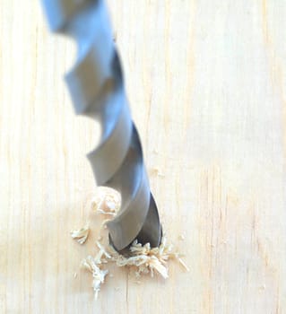 Drilling through a piece of southern yellow pine