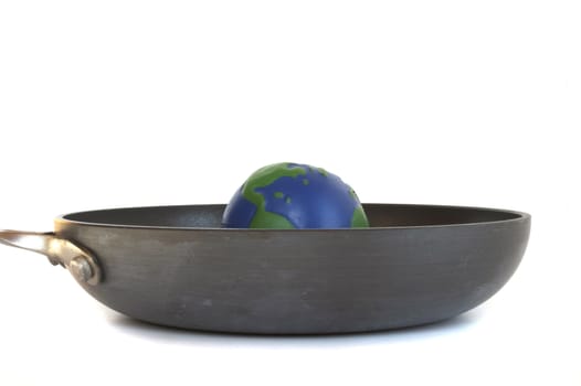  Earth sits in a Frying pan to represent Global Warming.