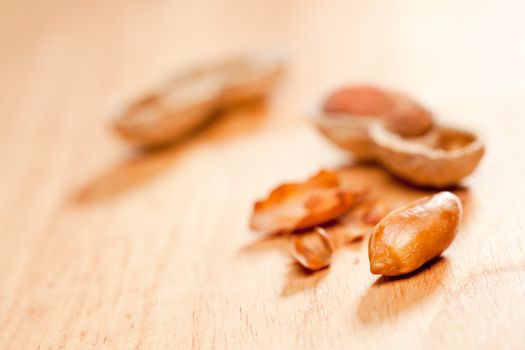 Peanuts on Wood Background with Dramatic Lighting.