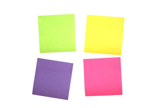 Four multi colored post it notes scattered close together