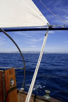 Sailboat sailing blue sea on sunny summer day in Mediterranean