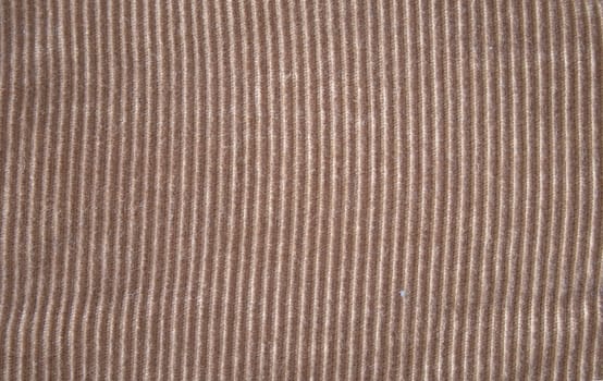 A brownish tan or beige corduroy background texture