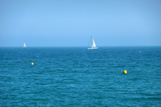 A sail boat just of the Brighton coast.