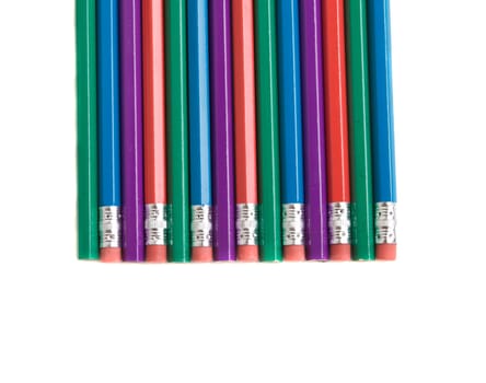 Several alternating multi colored pencils isolated on white