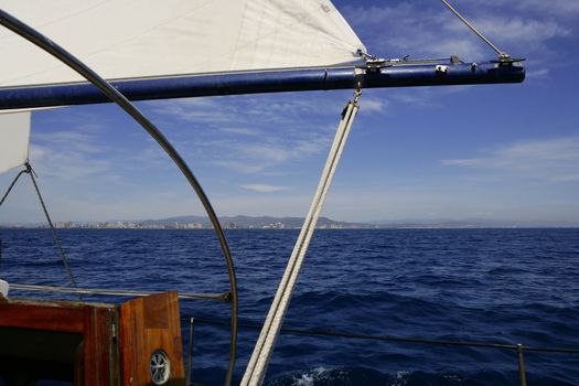 Sailboat sailing blue sea on sunny summer day in Mediterranean