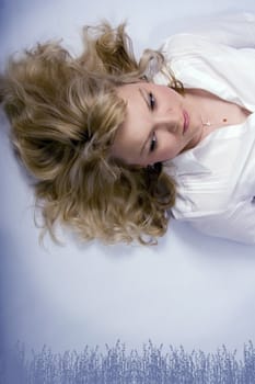 Blonde relaxed woman with curly hair