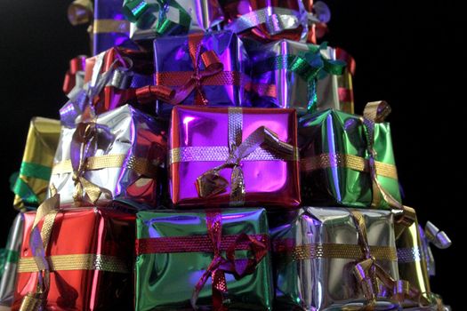 Stack of wrapped gifts in foil