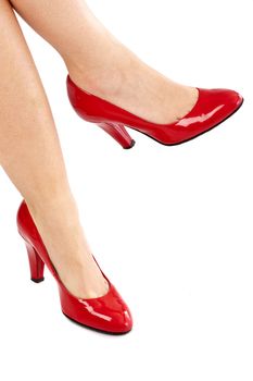 Woman's leg with sexy red pumps with high heels