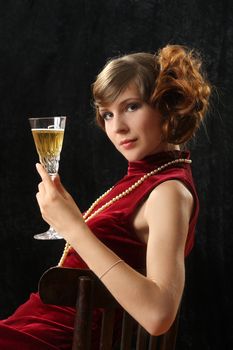 The beautiful girl with a wine glass