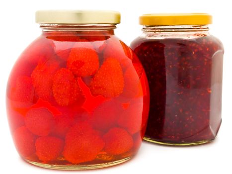 Jars with jam and compote against the white background