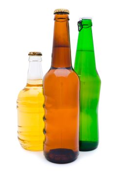three multicolored bottles of beer against the white background